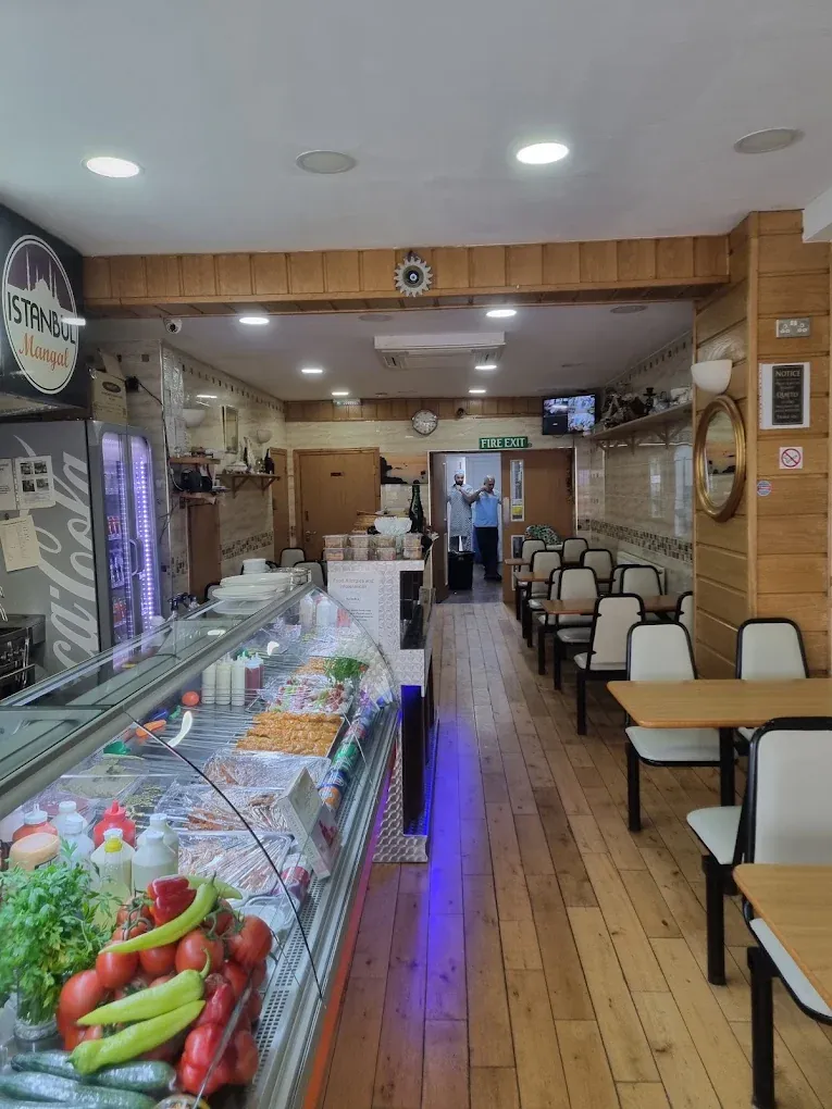 Istanbul Mangal dining room with wooden tables and the fresh salad and meze counter