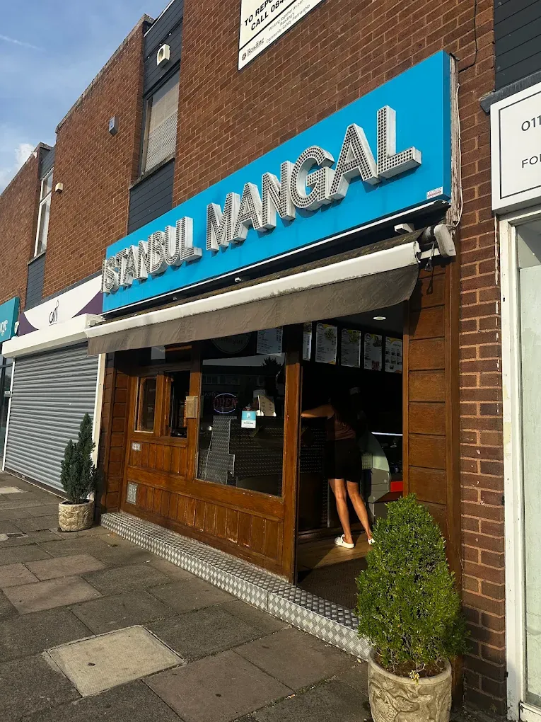 Istanbul Mangal shopfront on a sunny day with its bright blue sign and wooden frontage